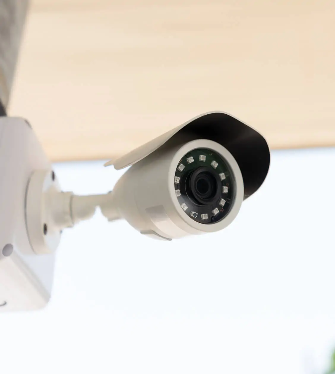 Outdoor security camera with infrared night vision installed for residential and commercial surveillance.